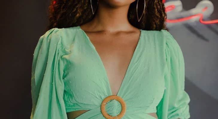 Person wearing a deep v-neck dress.