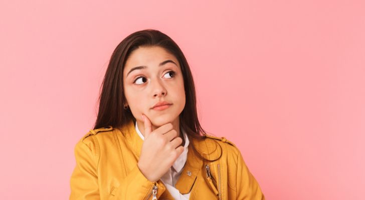 A girl who has a wondering expression on her face.