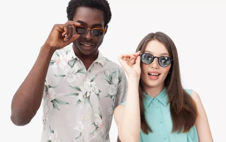 A man and woman wearing sunglasses