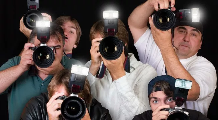 A group of photographers taking pictures..