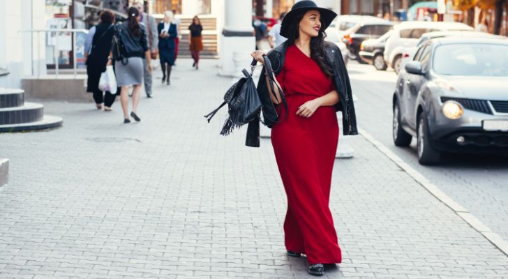 A woman posing in the street. 