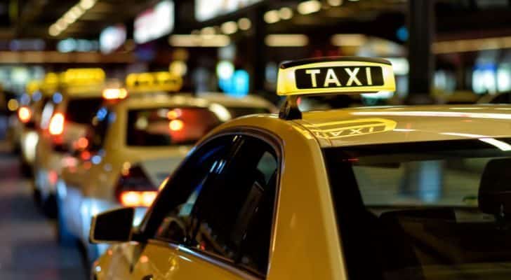 Yellow taxis waiting in line.