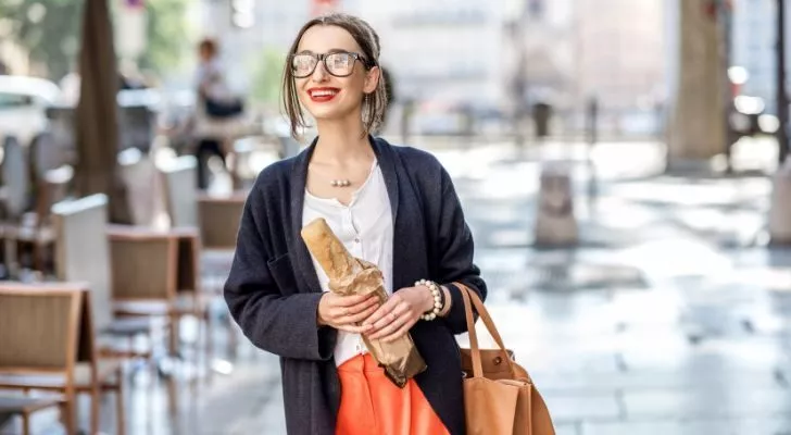 Woman holding a baguette