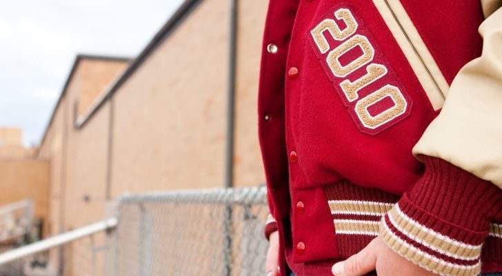 A person wearing a letterman jacket