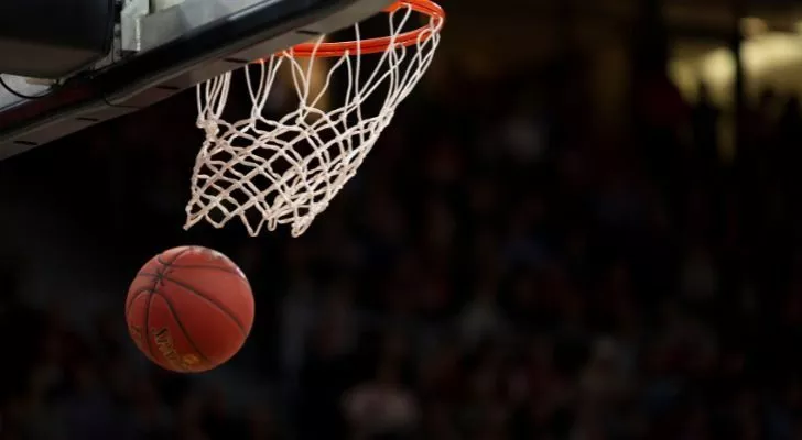 A basketball shot through a hoop